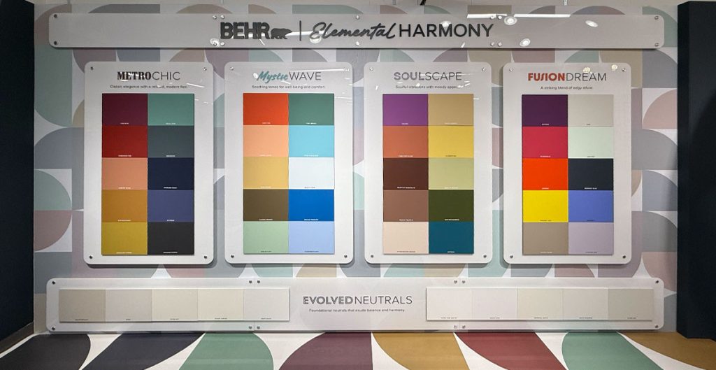 A display wall features four color palettes—Metro Chic, Mystic Wave, Soulscape, and Fusion Dream—highlighting current paint trends. Below, a row labeled Evolved Neutrals displays a range of neutral shades inspired by NeoCon innovations.