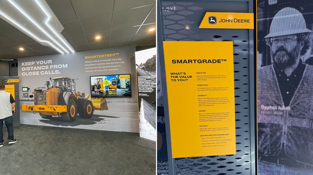 Two display panels at ConExpo 2026 showcase John Deere technology. The left panel features a large yellow loader and highlights Smarter Safety, while the right panel presents SmartGrade™ value with a black-and-white image of a worker.